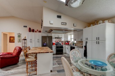 Step inside this beautifully updated 3-bedroom, 2-bath, 2-car on The Club At Pelican Bay - North Course in Florida - for sale on GolfHomes.com, golf home, golf lot