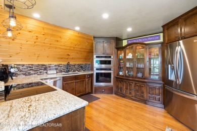 Experience luxury living in this beautiful home, perfectly on Cedar Creek Golf Course in Wyoming - for sale on GolfHomes.com, golf home, golf lot
