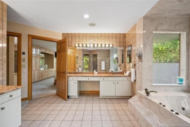 Step into country club living at its finest in this expansive on Pipers Landing Country Club in Florida - for sale on GolfHomes.com, golf home, golf lot