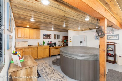 Experience luxury living in this beautiful home, perfectly on Cedar Creek Golf Course in Wyoming - for sale on GolfHomes.com, golf home, golf lot