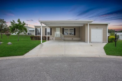 This practically NEW 2021 Built 3/2 Split plan home is located on Zellwood Station Country Club in Florida - for sale on GolfHomes.com, golf home, golf lot