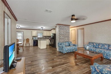 This practically NEW 2021 Built 3/2 Split plan home is located on Zellwood Station Country Club in Florida - for sale on GolfHomes.com, golf home, golf lot