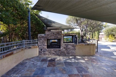 Massive Lot with all Slate Tile, Double Sided Fireplace and TV on Rancho California RV Resort in California - for sale on GolfHomes.com, golf home, golf lot