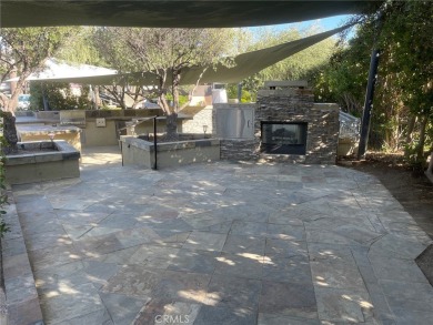 Massive Lot with all Slate Tile, Double Sided Fireplace and TV on Rancho California RV Resort in California - for sale on GolfHomes.com, golf home, golf lot