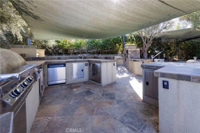 Massive Lot with all Slate Tile, Double Sided Fireplace and TV on Rancho California RV Resort in California - for sale on GolfHomes.com, golf home, golf lot