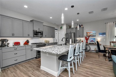 Experience resort-style living in this beautifully upgraded on Trilogy at Ocala Preserve in Florida - for sale on GolfHomes.com, golf home, golf lot