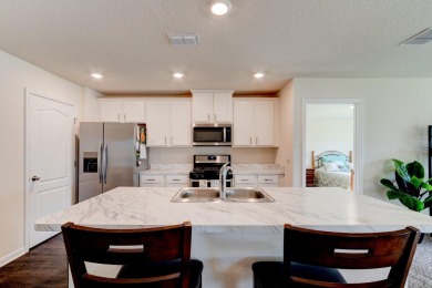 This beautifully maintained, nearly new 3-bedroom, 2-bath home on Grand Reserve Golf Course in Florida - for sale on GolfHomes.com, golf home, golf lot