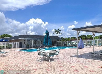 Welcome Home to this move-in ready 2-bed/ 2-bath home +bonus on Oriole Golf and Tennis Club in Florida - for sale on GolfHomes.com, golf home, golf lot