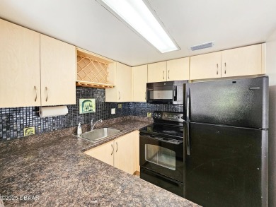 Step into this delightful one-bedroom second-floor condo, where on Daytona Beach Golf Club in Florida - for sale on GolfHomes.com, golf home, golf lot