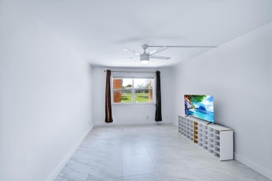 Beautifully updated 1 bed, 1.5 bath condo in the heart of on Sunrise Lakes Phase IV Golf Course in Florida - for sale on GolfHomes.com, golf home, golf lot