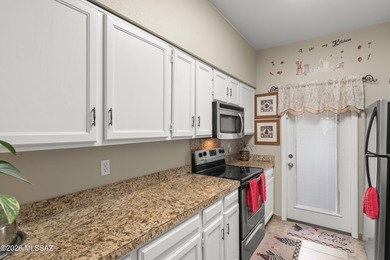 This well-maintained townhome offers elevated golf course and on Desert Hills Golf Club of Green Valley in Arizona - for sale on GolfHomes.com, golf home, golf lot