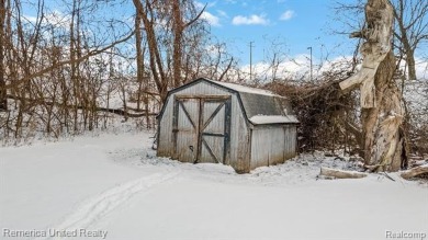 This charming tri-level home is situated on 2.5 acres of on Pine Knob Golf Club - Hawk in Michigan - for sale on GolfHomes.com, golf home, golf lot