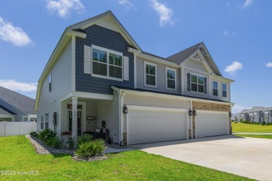 This gorgeous townhome resides in the Smithfield III section of on Brunswick Plantation and Golf Resorts in North Carolina - for sale on GolfHomes.com, golf home, golf lot