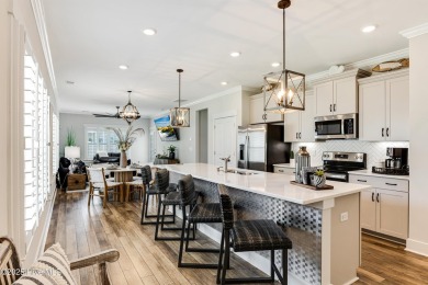This gorgeous townhome resides in the Smithfield III section of on Brunswick Plantation and Golf Resorts in North Carolina - for sale on GolfHomes.com, golf home, golf lot