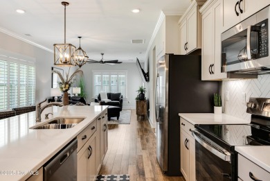 This gorgeous townhome resides in the Smithfield III section of on Brunswick Plantation and Golf Resorts in North Carolina - for sale on GolfHomes.com, golf home, golf lot