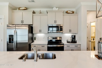 This gorgeous townhome resides in the Smithfield III section of on Brunswick Plantation and Golf Resorts in North Carolina - for sale on GolfHomes.com, golf home, golf lot