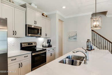 This gorgeous townhome resides in the Smithfield III section of on Brunswick Plantation and Golf Resorts in North Carolina - for sale on GolfHomes.com, golf home, golf lot