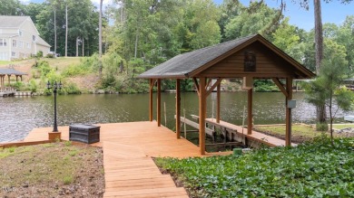 Live the Lake Life every day! This beautifully designed home on River Golf and Country Club at Lake Royale in North Carolina - for sale on GolfHomes.com, golf home, golf lot