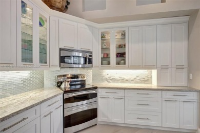 Stunning totally updated 3-bed, 3-bath home in exclusive Bay on Weston Hills Country Club in Florida - for sale on GolfHomes.com, golf home, golf lot