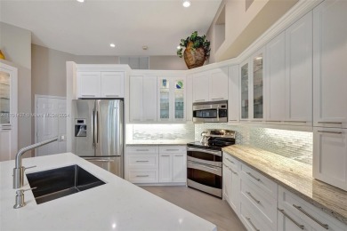 Stunning totally updated 3-bed, 3-bath home in exclusive Bay on Weston Hills Country Club in Florida - for sale on GolfHomes.com, golf home, golf lot