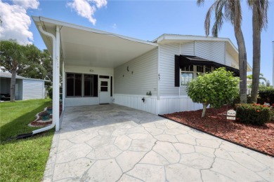 Spacious 2005 Triple-Wide Jacobsen built home situated on a 7 on Maple Leaf Golf and Country Club in Florida - for sale on GolfHomes.com, golf home, golf lot