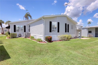 Spacious 2005 Triple-Wide Jacobsen built home situated on a 7 on Maple Leaf Golf and Country Club in Florida - for sale on GolfHomes.com, golf home, golf lot