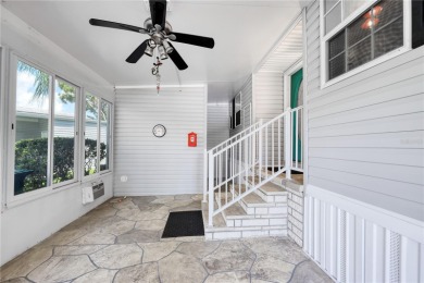 Spacious 2005 Triple-Wide Jacobsen built home situated on a 7 on Maple Leaf Golf and Country Club in Florida - for sale on GolfHomes.com, golf home, golf lot