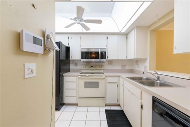 Looking for a ground-floor condo with a beautiful golf course on Palm Aire Country Club of Sarasota in Florida - for sale on GolfHomes.com, golf home, golf lot