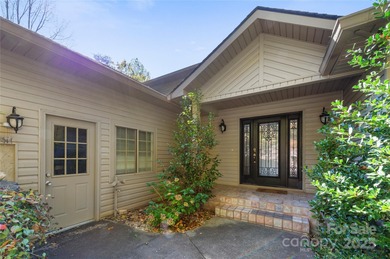 Tucked along the 8th hole of Apple Valley Golf Course, this on Rumbling Bald Resort on Lake Lure in North Carolina - for sale on GolfHomes.com, golf home, golf lot