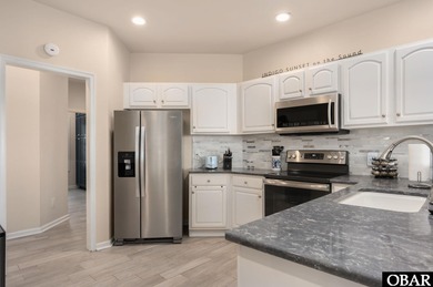 Set on the soundfront in The Currituck Club's Magnolia Bay on The Currituck Golf Club in North Carolina - for sale on GolfHomes.com, golf home, golf lot