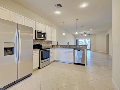 This beautifully maintained *SEAGROVE* villa is ideally located on Sarasota National Golf Club in Florida - for sale on GolfHomes.com, golf home, golf lot