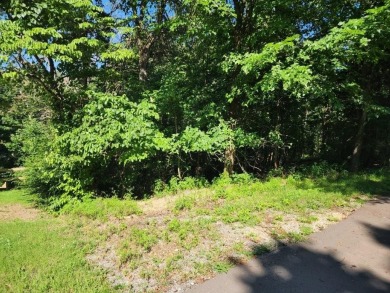 Nestled in a peaceful corner of Bella Vista, this .33acre lot is on Bella Vista - Metfield Golf Complex and Country Club in Arkansas - for sale on GolfHomes.com, golf home, golf lot