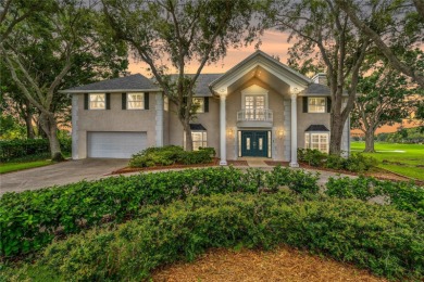 Step into timeless elegance in this stunning Colonial-style on Feather Sound Country Club in Florida - for sale on GolfHomes.com, golf home, golf lot