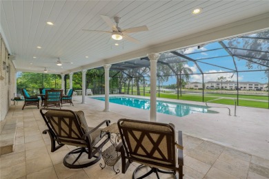 Step into timeless elegance in this stunning Colonial-style on Feather Sound Country Club in Florida - for sale on GolfHomes.com, golf home, golf lot