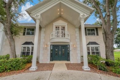 Step into timeless elegance in this stunning Colonial-style on Feather Sound Country Club in Florida - for sale on GolfHomes.com, golf home, golf lot