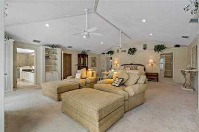 Step into timeless elegance in this stunning Colonial-style on Feather Sound Country Club in Florida - for sale on GolfHomes.com, golf home, golf lot