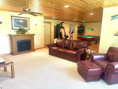 Discover unparalleled executive living perfectly situated on the on Traverse City Golf and Country Club in Michigan - for sale on GolfHomes.com, golf home, golf lot