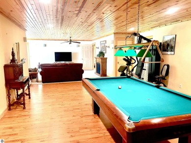 Discover unparalleled executive living perfectly situated on the on Traverse City Golf and Country Club in Michigan - for sale on GolfHomes.com, golf home, golf lot