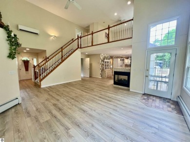 Discover unparalleled executive living perfectly situated on the on Traverse City Golf and Country Club in Michigan - for sale on GolfHomes.com, golf home, golf lot