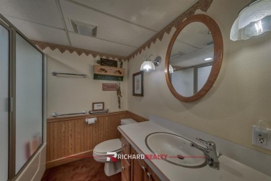 Situated on the ninth hole of the Olive Glenn Golf Course, 10 on Olive Glenn Golf and Country Club in Wyoming - for sale on GolfHomes.com, golf home, golf lot