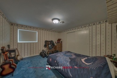 Situated on the ninth hole of the Olive Glenn Golf Course, 10 on Olive Glenn Golf and Country Club in Wyoming - for sale on GolfHomes.com, golf home, golf lot