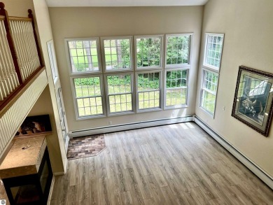 Discover unparalleled executive living perfectly situated on the on Traverse City Golf and Country Club in Michigan - for sale on GolfHomes.com, golf home, golf lot