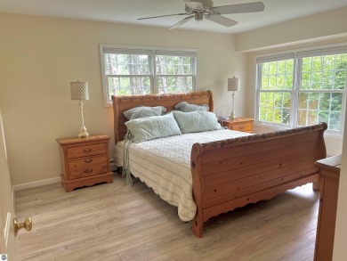 Discover unparalleled executive living perfectly situated on the on Traverse City Golf and Country Club in Michigan - for sale on GolfHomes.com, golf home, golf lot