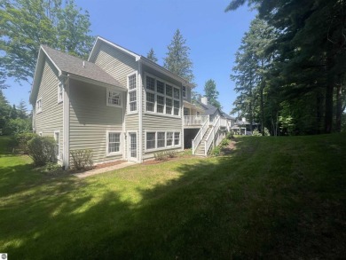 Discover unparalleled executive living perfectly situated on the on Traverse City Golf and Country Club in Michigan - for sale on GolfHomes.com, golf home, golf lot