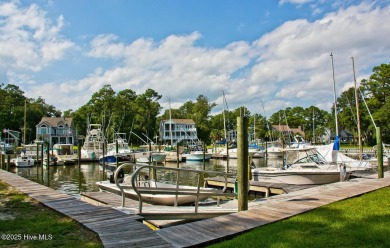 This 2-bedroom, 3-bath home, second row from the sound, offers a on The Country Club of the Crystal Coast in North Carolina - for sale on GolfHomes.com, golf home, golf lot