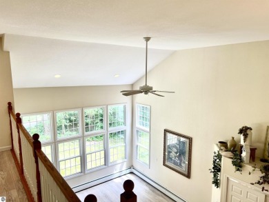 Discover unparalleled executive living perfectly situated on the on Traverse City Golf and Country Club in Michigan - for sale on GolfHomes.com, golf home, golf lot