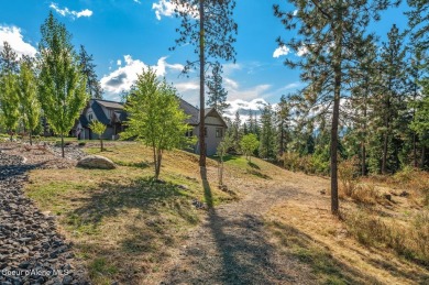 SPECTACULAR AND PRIVATE RETREAT SETTING AMONGST THE TREES IN on Hayden Lake Country Club in Idaho - for sale on GolfHomes.com, golf home, golf lot