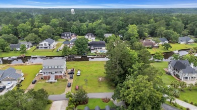 Discover the perfect blend of natural beauty and southern charm on Wedgefield Plantation Golf Club in South Carolina - for sale on GolfHomes.com, golf home, golf lot