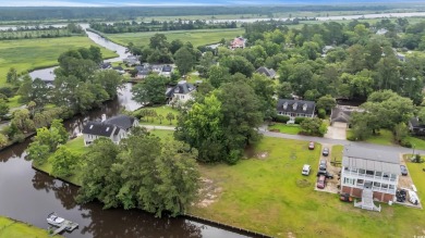 Discover the perfect blend of natural beauty and southern charm on Wedgefield Plantation Golf Club in South Carolina - for sale on GolfHomes.com, golf home, golf lot