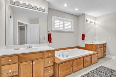 Charming brick home located in the gated community of Lockwood on Lockwood Folly Country Club in North Carolina - for sale on GolfHomes.com, golf home, golf lot